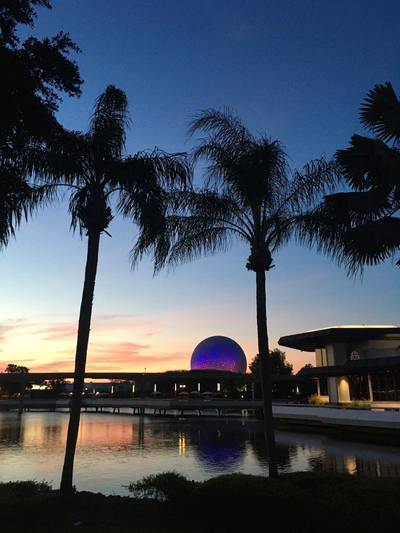 View of Spaceship Earth with Epcot Welcome Center in foreground.