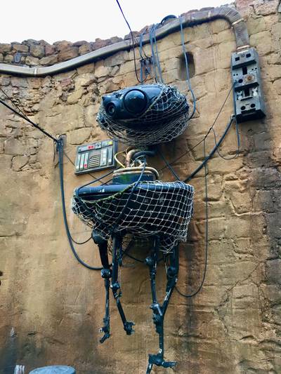 Imperial Probe Droid hanging in storage behind the Galaxy's Edge Droid Depot.